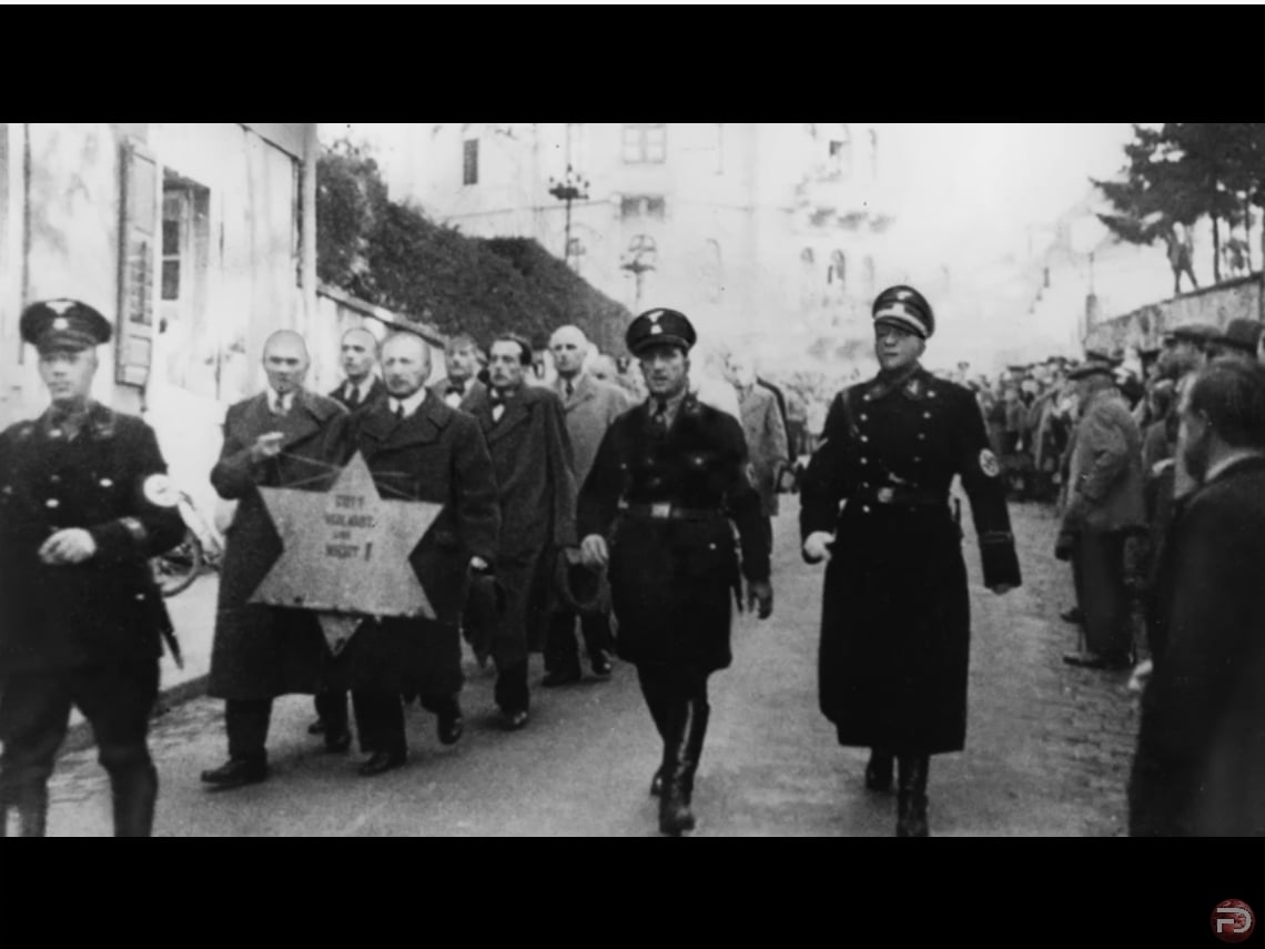 SS men and police take away the Jewish men after Kristallnacht